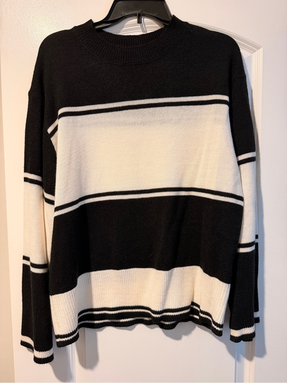Divided Black Knit Sweater with Cream Accent
